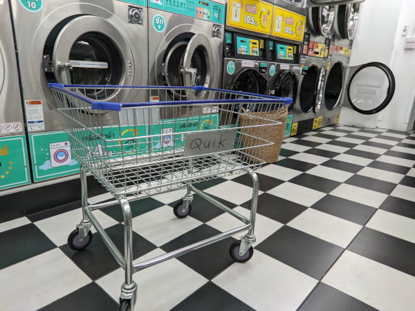 Clean and hygienic washing machines and seating area inside Quik Laundry